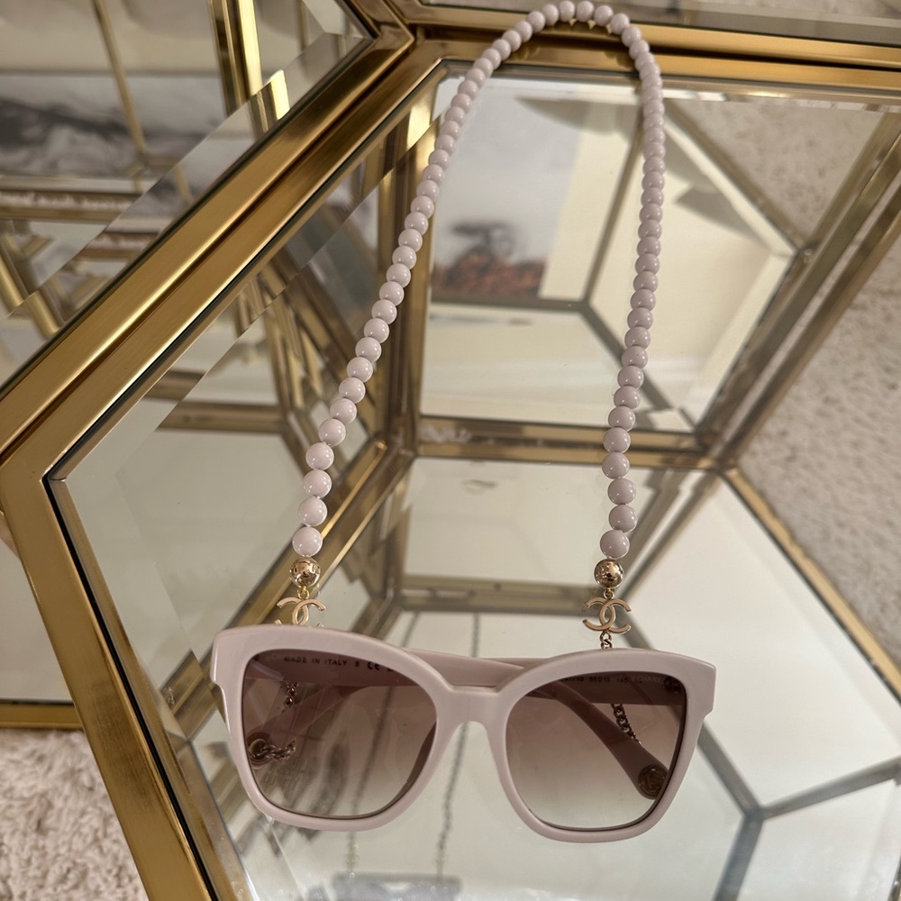 Chanel sunglasses with hanging pearls and “gold CC” logo on each side